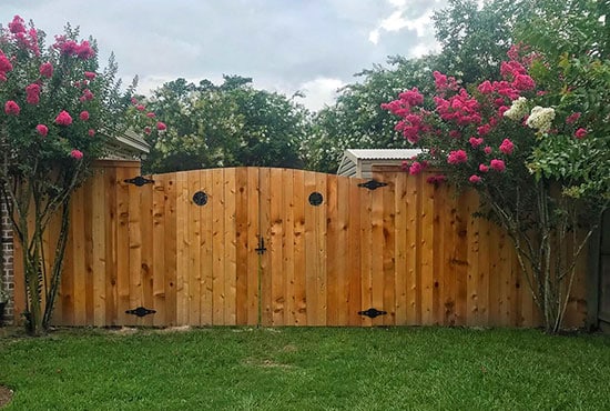 capped fence with arch gate and portholes AFTER