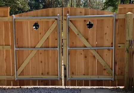 Re-enforced Double Wooden Gate with Portholes | Mandeville Fence Company