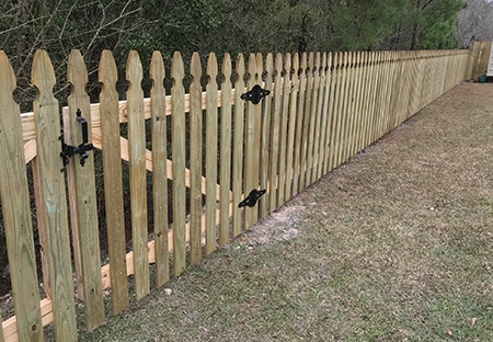 Pressure-Treated Wood Picket Fence in Lacombe